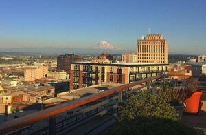 view from rooftop deck of the triangle townhomes in downtown tacoma looking at the city and mt rainier