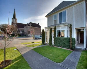 house near 6th ave with church in the background