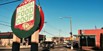 A sign says Tacoma Food Coop in Tacoma WA
