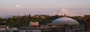 mt rainier over the tacoma dome under a full moon
