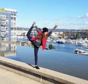 woman doing yoga on the thea foss in Tacoma