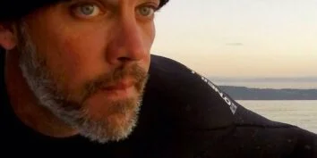 dean burke paddling on commencement bay