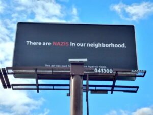 Billboard says "There are nazis in our neighborhood"