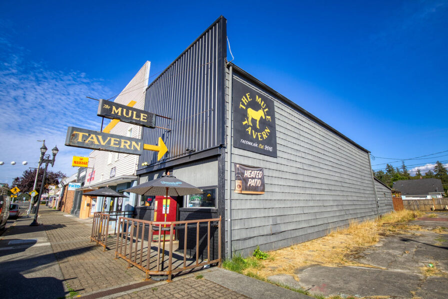 a photo of the mule, a bar on south tacoma way on a sunny day