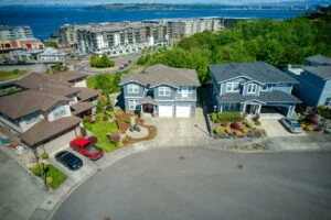 homes on a cul de sac above point ruston with cars in the driveway