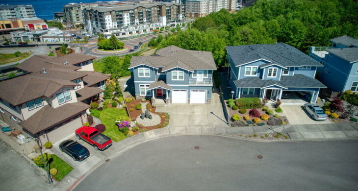 homes on a cul de sac above point ruston with cars in the driveway