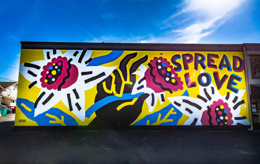 a yellow, blue, and pink mural with an abstract daffodil in sumner wa