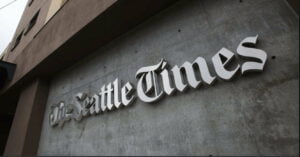 the Seattle times logo on the side of a building