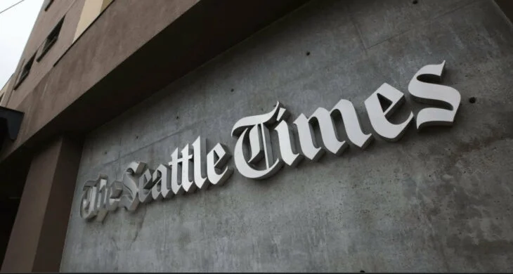 the Seattle times logo on the side of a building