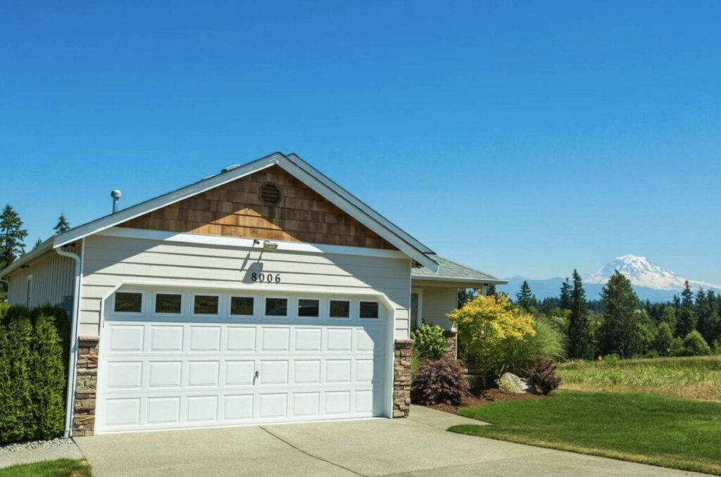 garage of a home with land and mt rainier in the distance in bonney lake