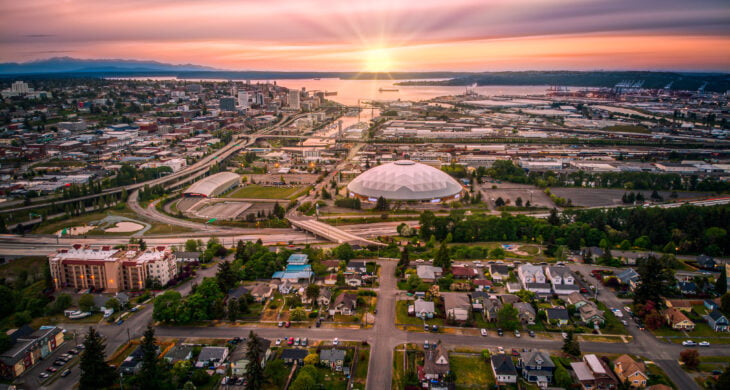 a photo of tacoma washington at sunset over the tacoma dome