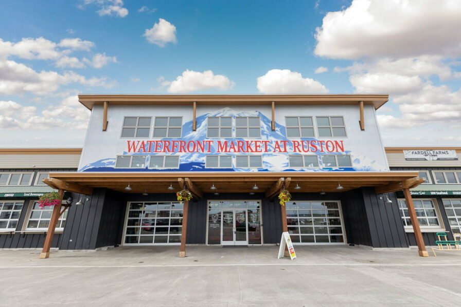 a building with a sign that says waterfront market in ruston, in the point ruston neighborhood of tacoma