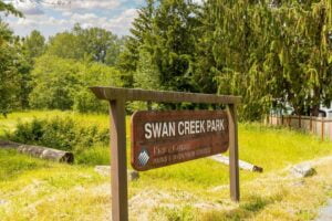 a sign for Swan Creek Park in the Waller neighborhood of Tacoma WA