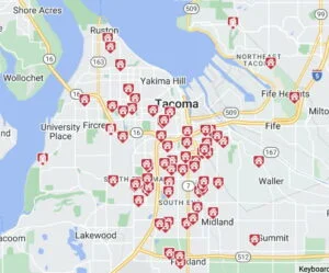 A map of Tacoma with red pins showing where in Tacoma homes have sold for prices under 500k in January 2023.