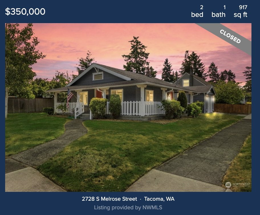 A photograph of a central tacoma craftsman home at dusk. This home sold for 396k in 2023.