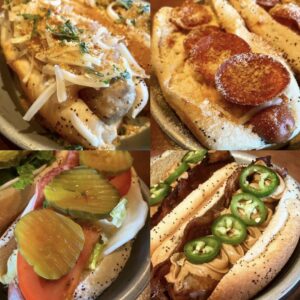 A photo of four different hot dogs with all the fixins from The Red Hot