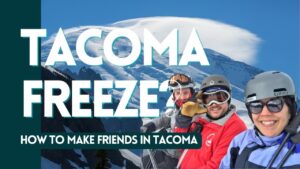 A picture of 3 people riding a ski lift in front of mt rainier with the words, "Tacoma Freeze? How to Make Friends in Tacoma Washington"